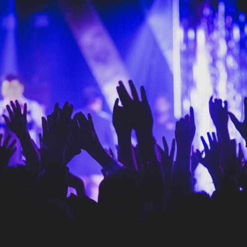 Crown Raising Hands during Performance